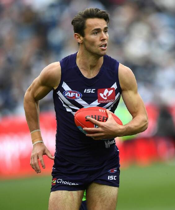 Lachie Weller of the Dockers is seen in action during the Round 14 AFL match between the Geelong Cats and the Fremantle Dockers at Simonds Stadium in Geelong, Sunday, June 25, 2017. (AAP Image/Julian Smith) NO ARCHIVING, EDITORIAL USE ONLY .