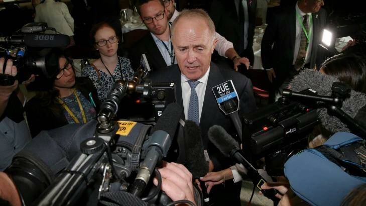 Reporters seek comment from Malcolm Turnbull on Tuesday morning.  Photo: Alex Ellinghausen