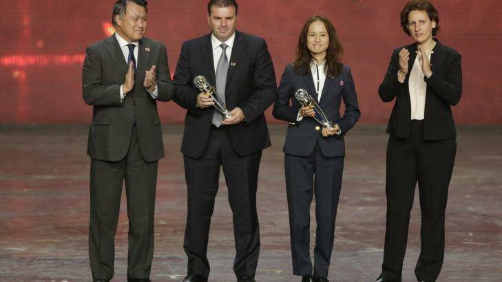 Trophy time: Australia's Ange Postecoglou, second left and Japan's Asako Takakura, second right hold their Coach of the year awards during the Asian Football Confederation (AFC) annual awards in New Delhi. Photo: Altaf Qadri