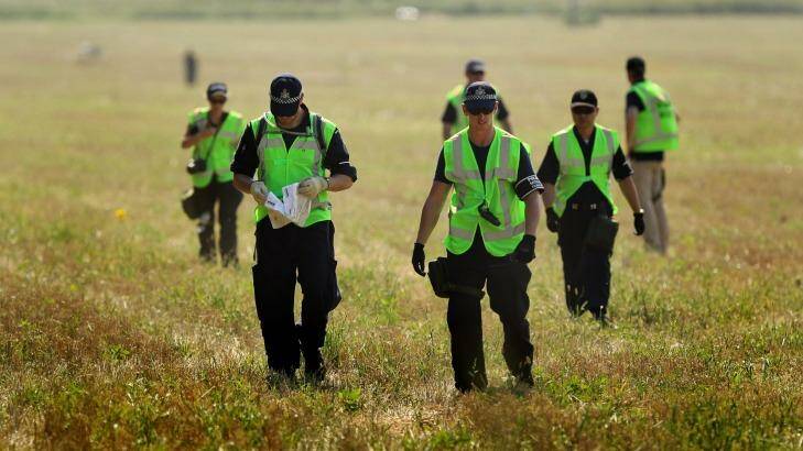 Australian Federal Police at the MH17 crash site with Dutch and Malaysian counterparts. Photo: Kate Geraghty