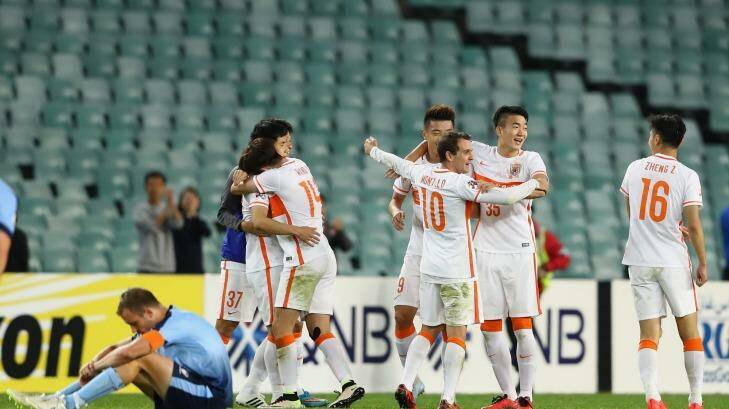 Blue ending: Shandong Luneng players celebrate at full-time on Wednesday night. Photo: Cameron Spencer