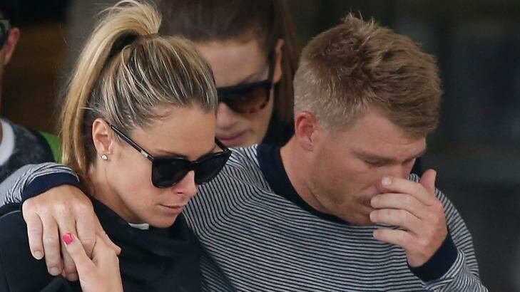 David Warner, accompanied by his wife Candice Falzon cries as he leaves the hospital on Thursday. Photo:  Daniel Munoz