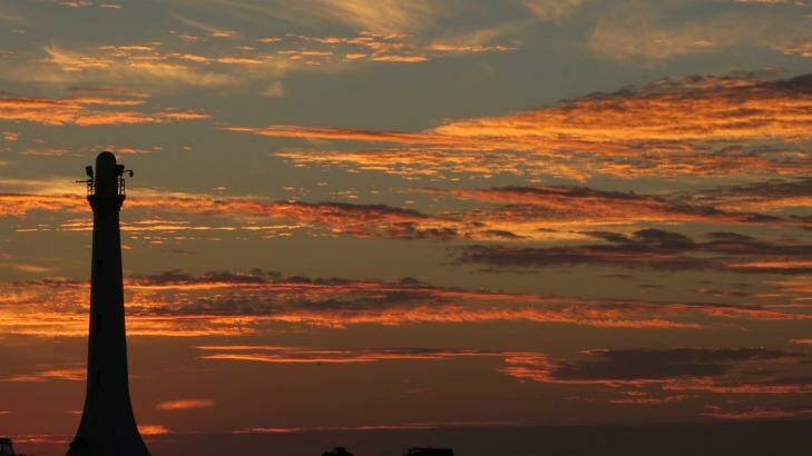 The sun sets over St Kilda last night. Photo: Leigh Henningham