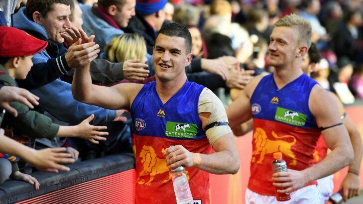 Tom Rockliff of the Lions (left) is seen after the Round 15 AFL match between the Essendon Bombers and Brisbane Lions at Etihad Stadium in Melbourne, Sunday, July 2, 2017. (AAP Image/Julian Smith) NO ARCHIVING, EDITORIAL USE ONLY