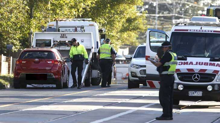 Police remove a car from the scene after a pedestrian fatality on Monday morning. Photo: Eddie Jim