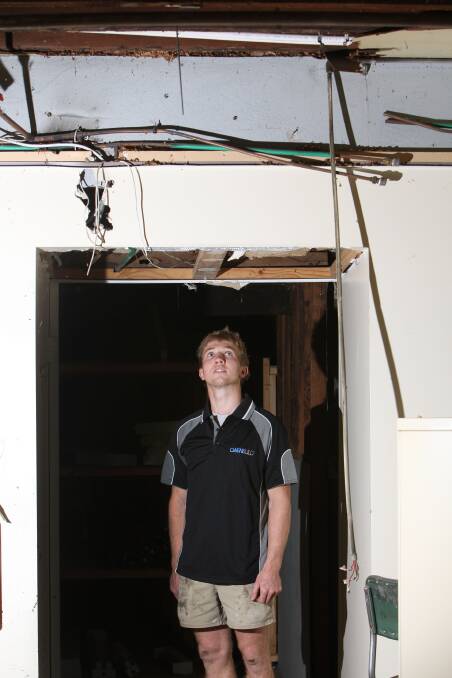 OwenBuild builder Sam Coleman, 21, inspects the ceiling area of The Standard’s former premises in Koroit Street, Warrnambool. Picture: ANGELA MILNE