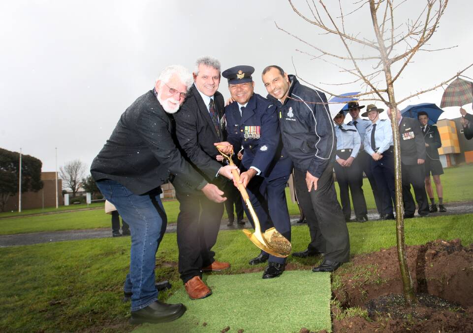 Robbie Lowe senior (left), Sergeant Ricky Morris, Warrant Officer Don Taylor and Victoria Police liaison officer Joey Chatfield at the planting yesterday. Picture: VICKY HUGHSON