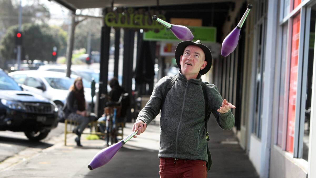 Mark Sheppard juggles his way to health and happiness as he strolls along Liebig Street yesterday. Picture: LEANNE PICKETT