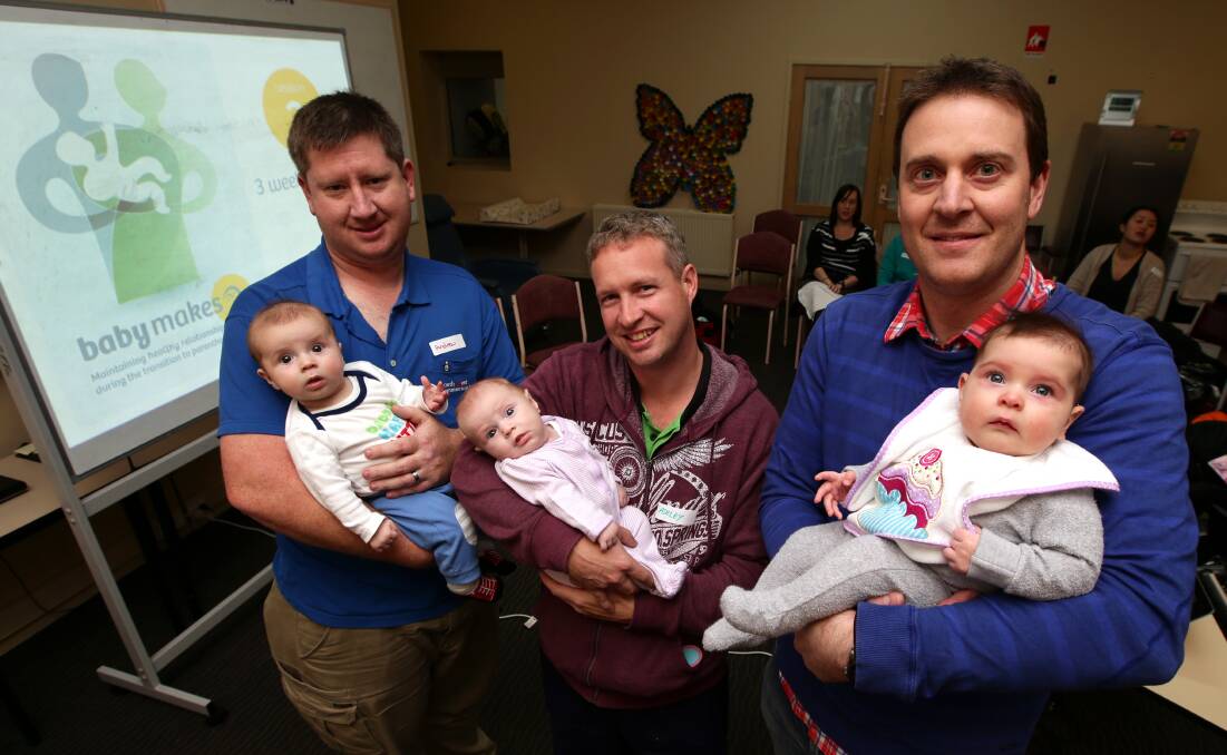 First-time fathers (from left) Mailors Flat’s Andrew Maher holding Nate, four months, Port Fairy’s Ashley Price with Sophie, three months, and Warrnambool’s David Harrington holding Julia, 16 weeks. Picture: DAMIAN WHITE