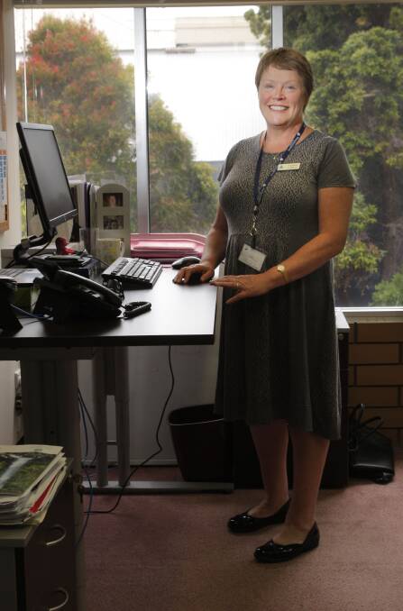 Director community development at the Warrnambool City Council, Vicky Mason, now does her work standing up to alleviate back pain from prolonged sitting.   Picture: ANGELA MILNE