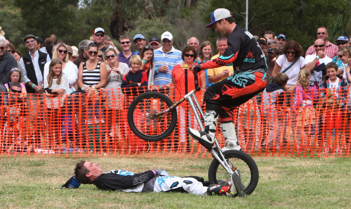 Flair Action Bikes’ Jack Field, of Brisbane, prepares to launch over Chris Bayles, of Launceston. 