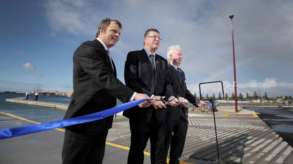Member for Western Victoria David O'Brien (left), Premier Denis Napthine and Glenelg Shire Mayor John Northcott cut the ribbon to open the new boat ramp at Portland Harbour. Picture: ROB GUNSTONE