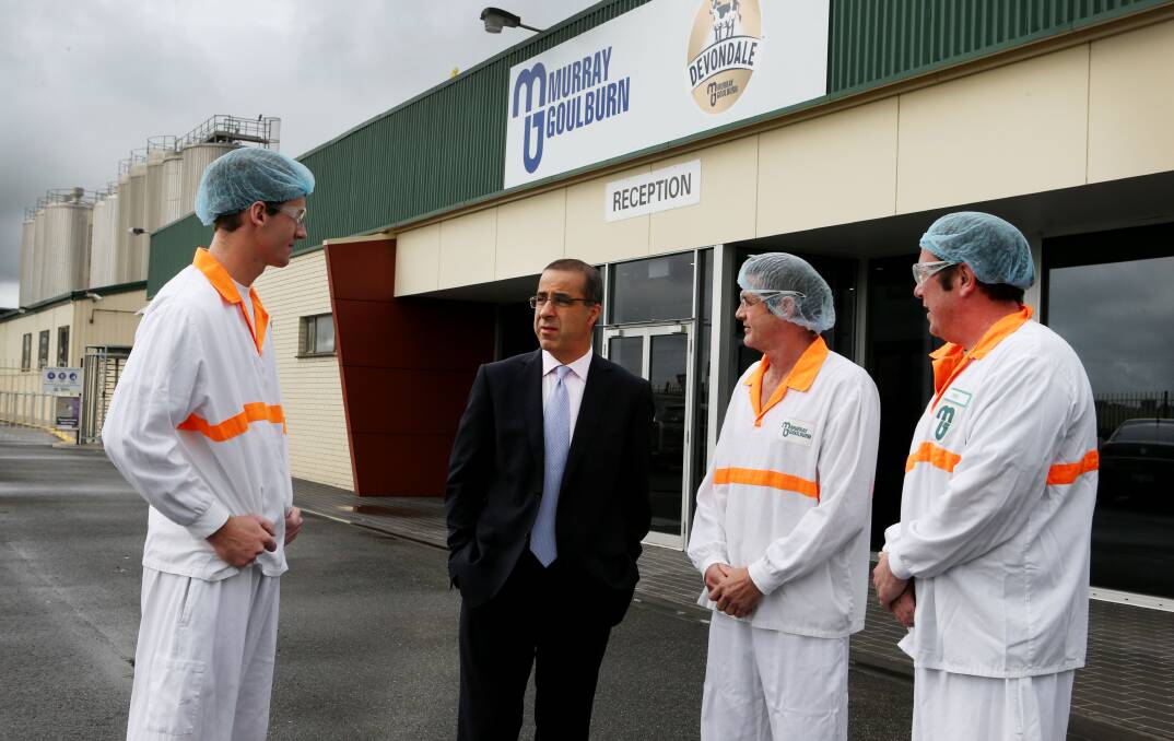 Murray Goulburn’s Koroit factory managing director Gary Helou (centre), discusses the $19m nutritional powders development with employees Tim McPherson (left), Bruce Knox and Chris Scrivenor.  Picture: LEANNE PICKETT