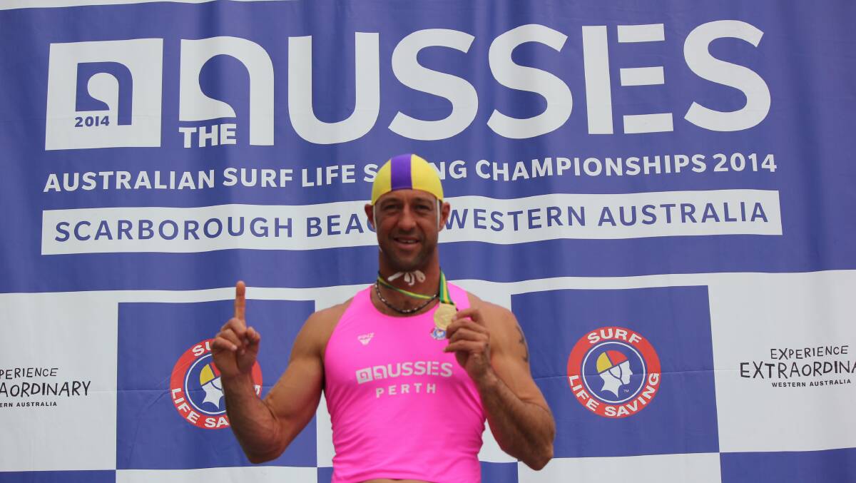 Port Fairy Surf Lifesaving Club’s Mark Plant celebrates his gold in the ski race at the national championships in Perth.