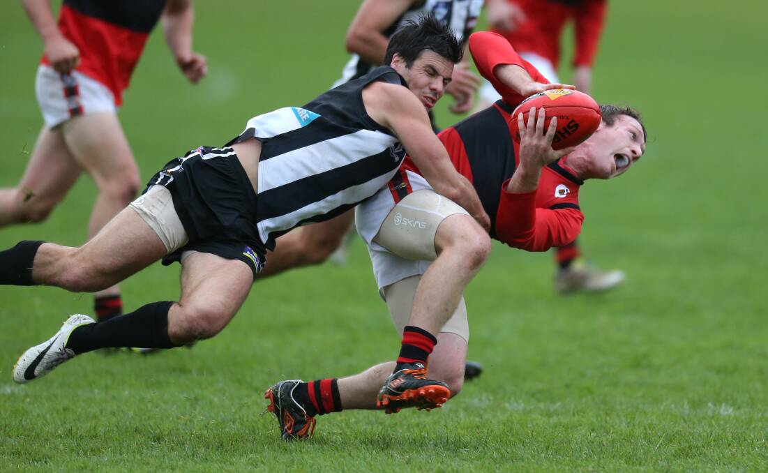Camperdown coach Phil Carse catches Cobden's Damon Delaney during the Magpies' win at Leura Oval. Picture: DAMIAN WHITE
