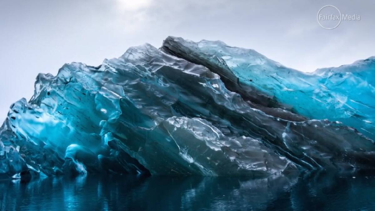 A photographer captured the flipped underside of an iceberg in Antarctica. 