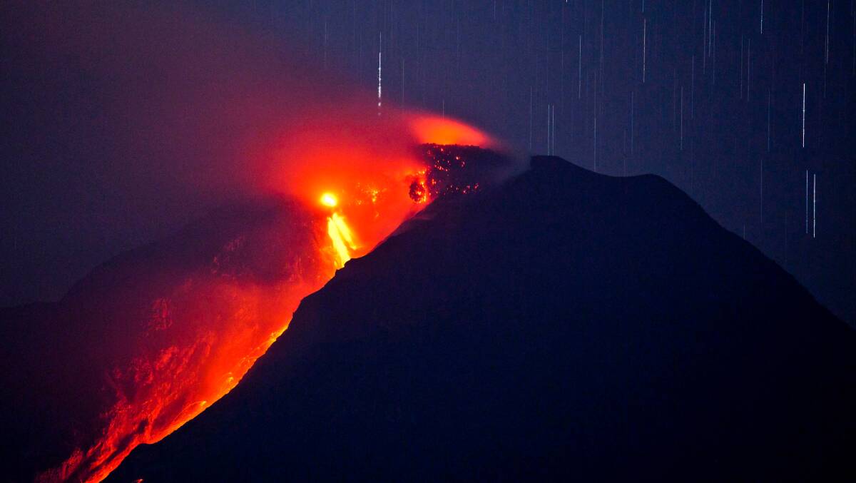 Hot lava runs down Mount Sinabung from a lava dome on January 3, 2014 in Karo District, North Sumatra, Indonesia. Picture: Getty