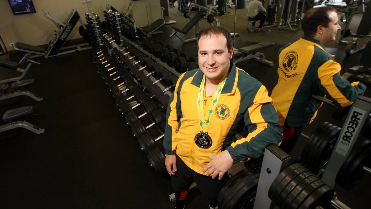 Medical student Robert Harniman is all smiles after clinching a silver medal at the world powerlifting championships in Sydney at the weekend. 