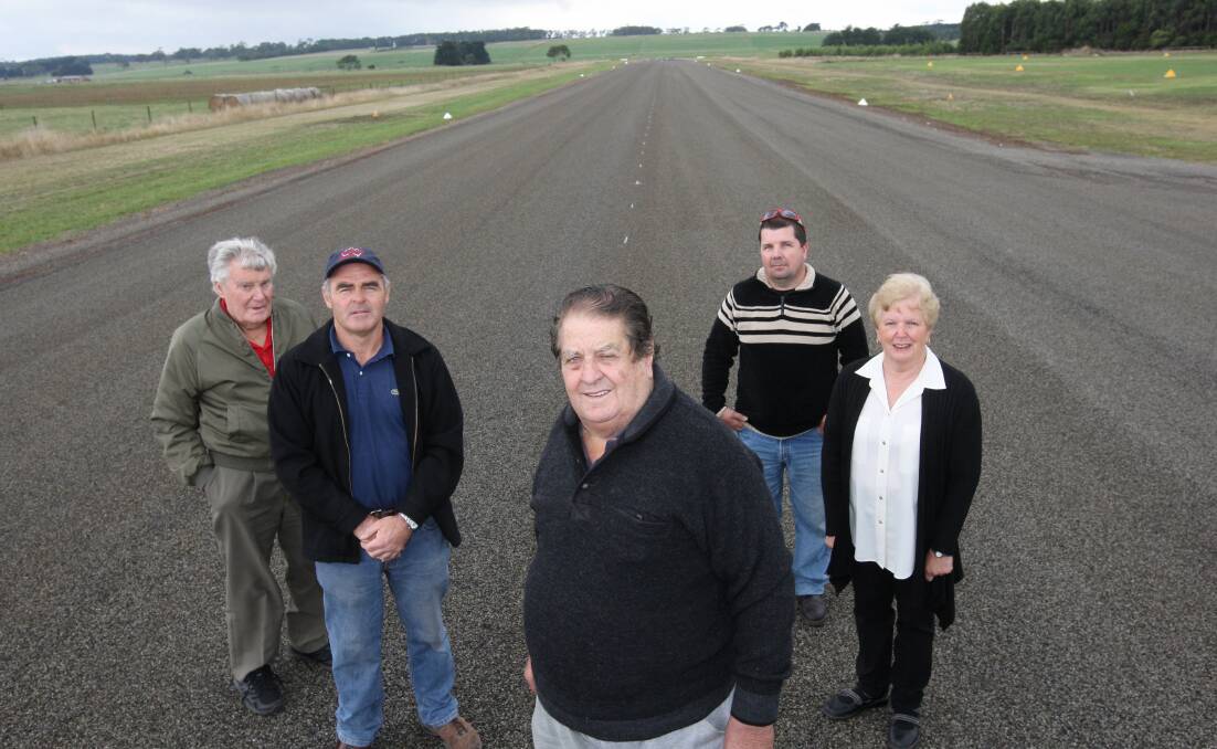 Cobden airport campaigners Lew Matthews (left), Bill Woodmason, past airport manager Kevin Norris, Cory Raven and Jan O’Connell survey the resurfaced runway.