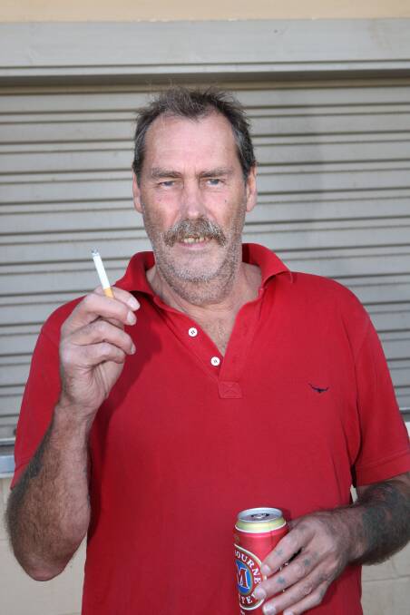 Gary Lambert at Reid Oval ignores the new smoking ban.