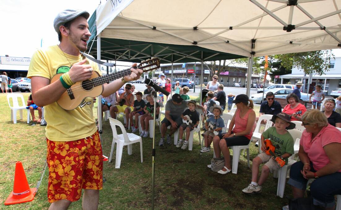 Thom Jackson gives a lesson in playing the ukelele at the Moyneyana Festival on the Port Fairy Village Green, which could soon be known as the Fiddler’s Green.  
