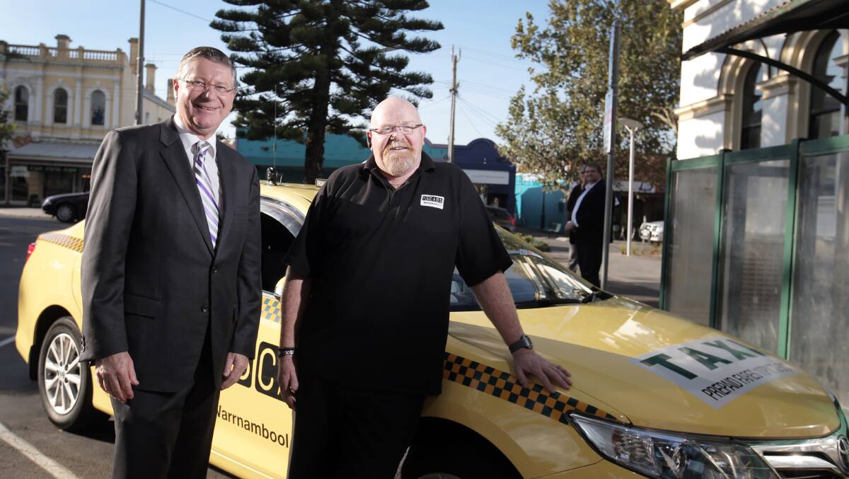 Premier Denis Napthine and Warrnambool taxi driver Darryl Williams at the Gilles Street rank yesterday.