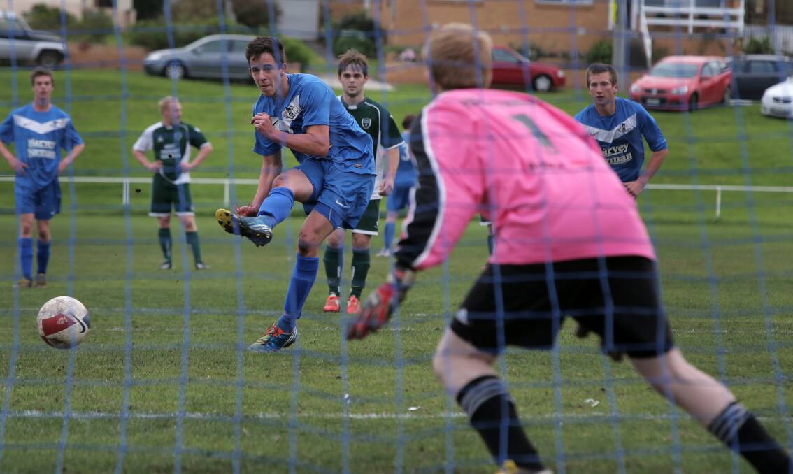 Warrnambool Rangers’ Dechlan Picken fires the penalty shot past Forest Rangers’ keeper Aaron Wood.  Picken’s hat-trick steered Warrnambool to a comfortable 7-1 victory at Jones Oval on Sunday.
