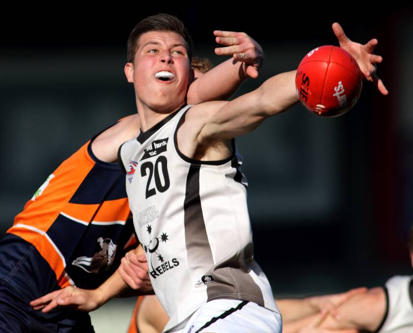 Rowan Marshall will bide his time with North Ballarat Roosters in 2015 after being overlooked in the AFL rookie draft.