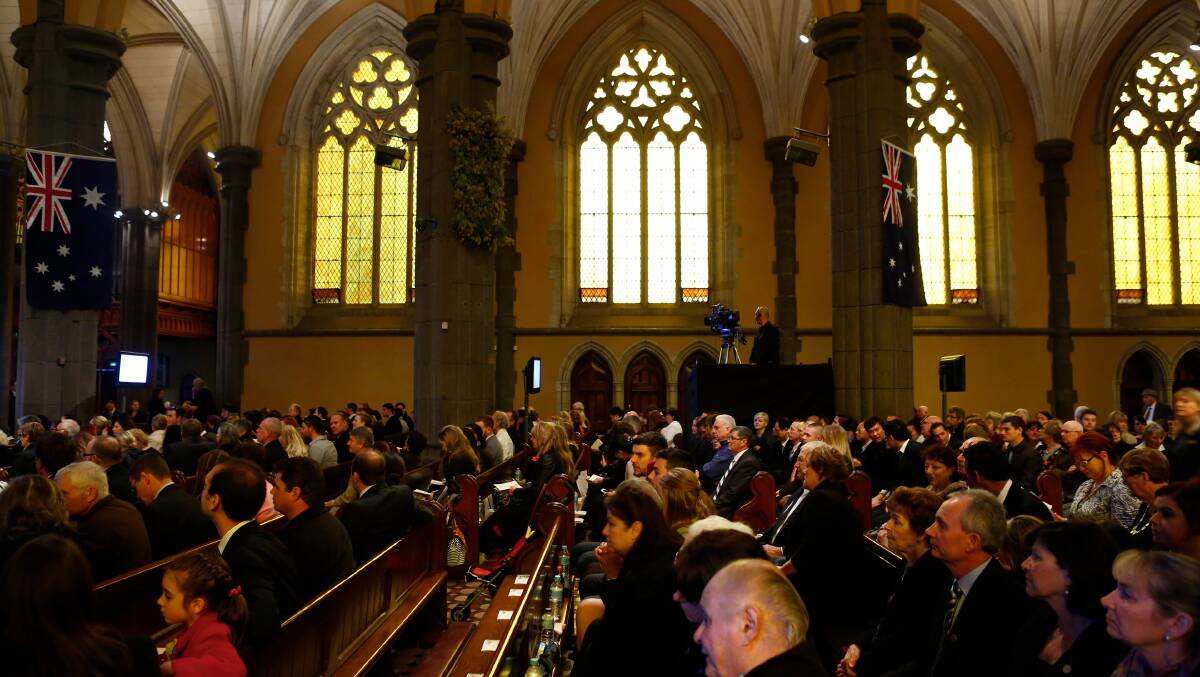 Mourners pay their respects at the National Memorial Service for victims of MH17 at St Patrick's Cathedral, Melbourne. Picture: Eddie Jim, The Age. 