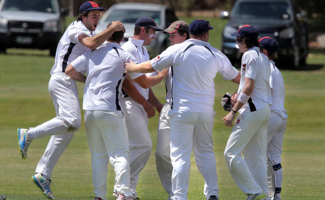 Heytesbury Rebels cricketers celebrate after Brad Burton’s second wicket.