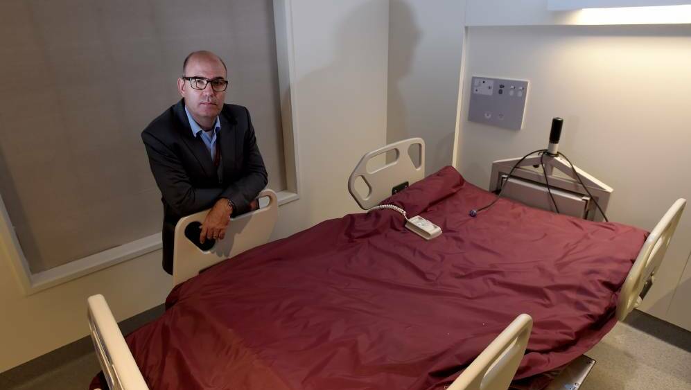 Bendigo Health director of medicine Dr Mark Savage pictured with a bariatric bed. Picture: JODIE WIEGARD