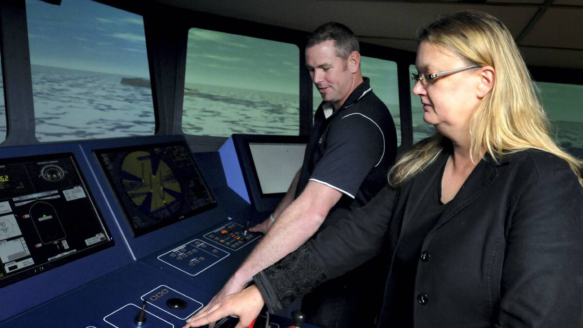 Researcher Paul Brown and his research supervisor Professor Margareta Lutzhoft at the helm of the simulated ship. Picture: GEOFF ROBSON