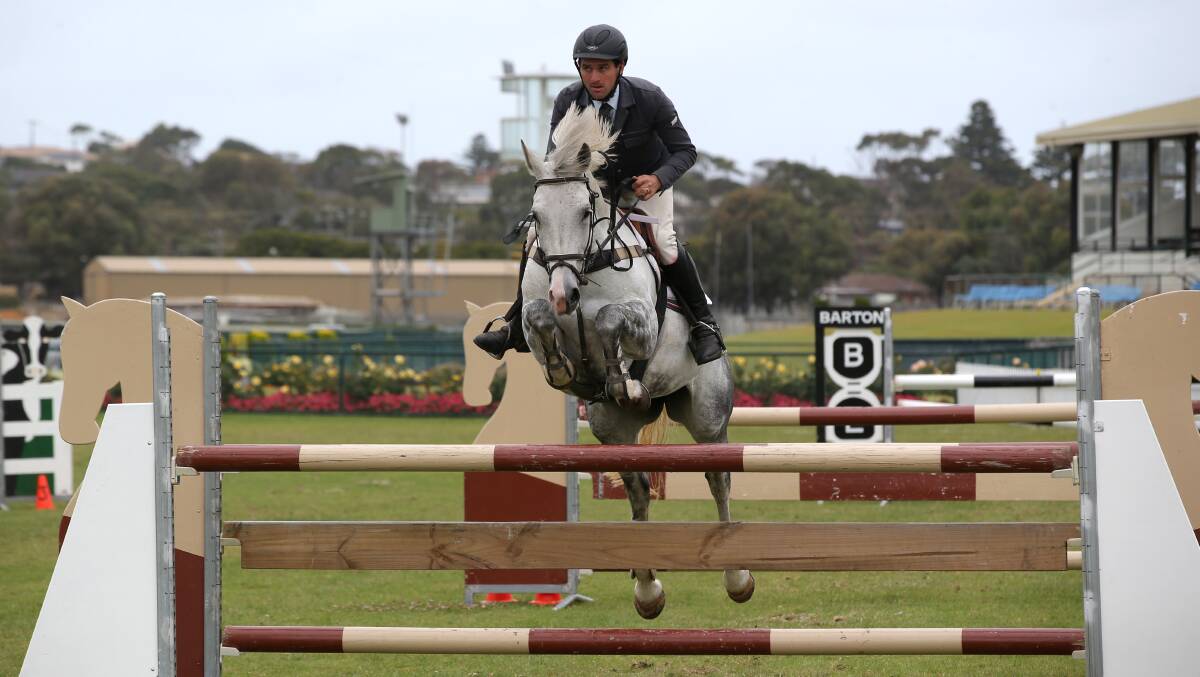 Tim Clarke with his horse Caltango at the Shipwreck Coast Showjumping Championships at Warrnambool racecourse. 150110DW03 Picture: DAMIAN WHITE
