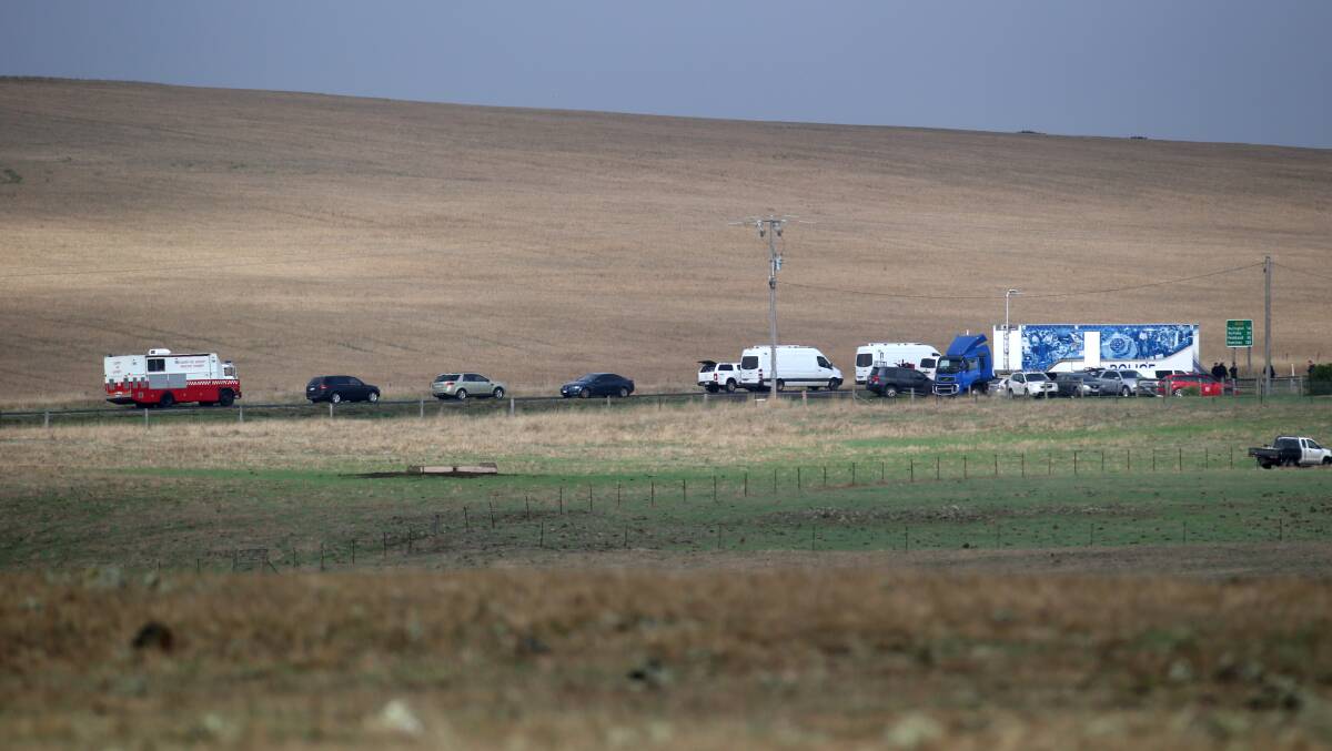 Police vehicles line Hamilton Highway just in front of Mt Elephant on the western side of Derrinallum.