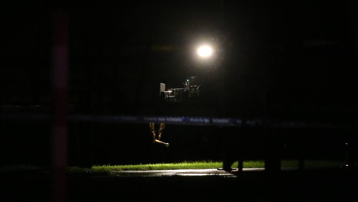 A bomb squad robot moves the suspected pipe bomb to the controled detonation area on Tuesday night. Pcture: AARON SAWALL