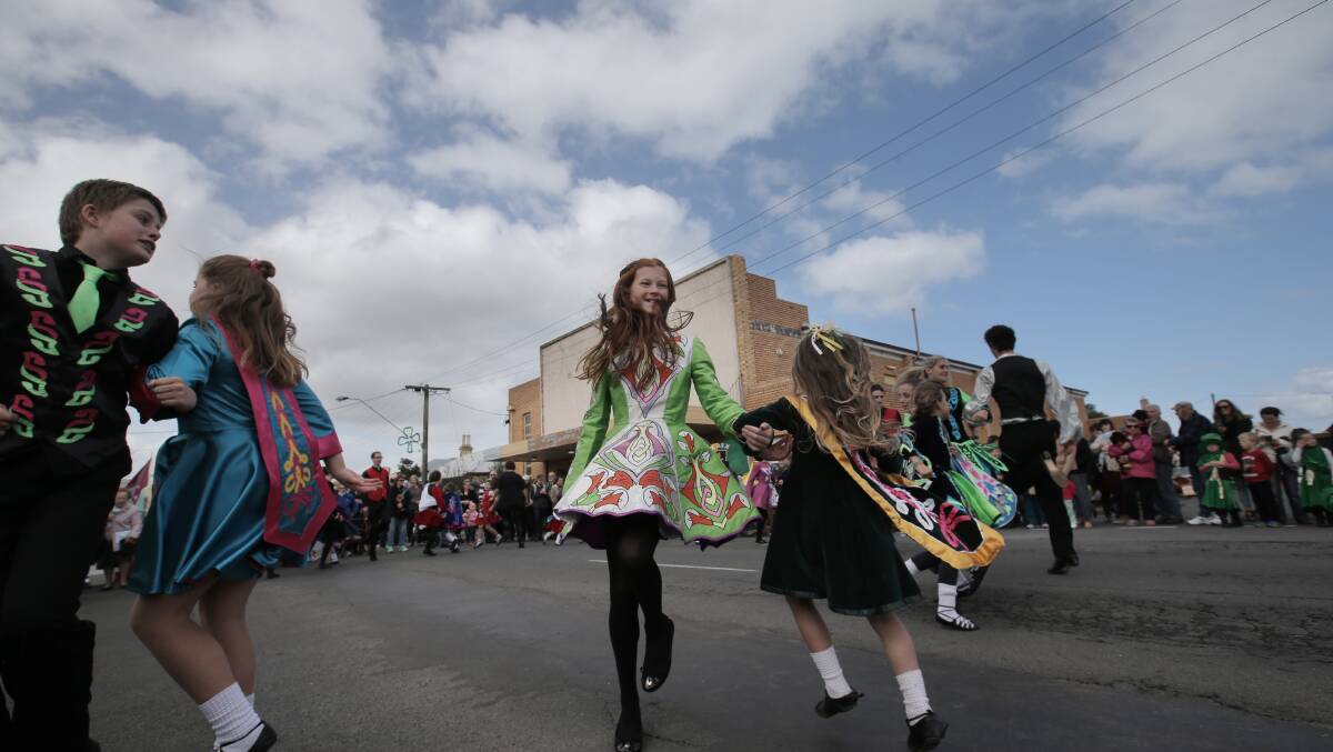 Allannah Sander, 12, hooking arms with Liberty Jubb, 6, from O'Shea-Ryan Academy of Irish Dance. Picture: VICKY HUGHSON