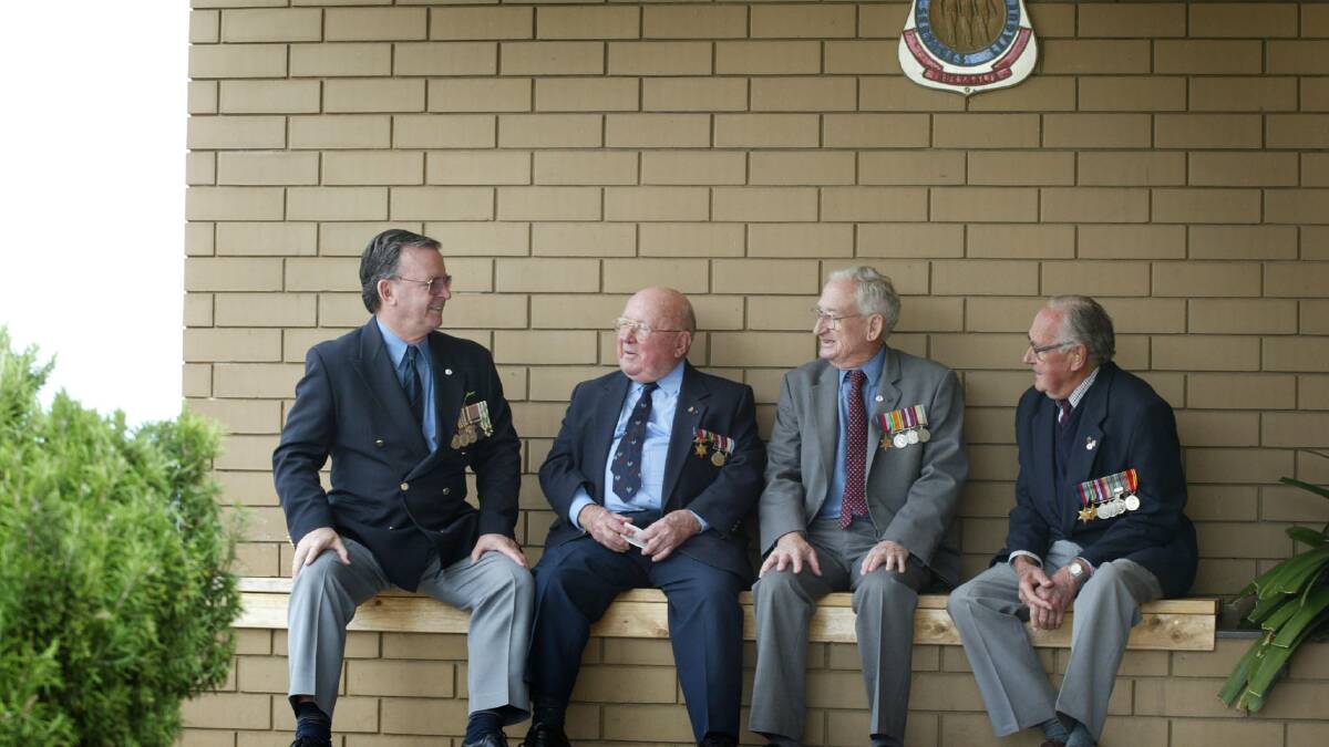 Doug Heazlewood, Kevin Horne, Bryce Agnew and Greg Gillespie catch up after Warrnambool's Anzac Day service. 