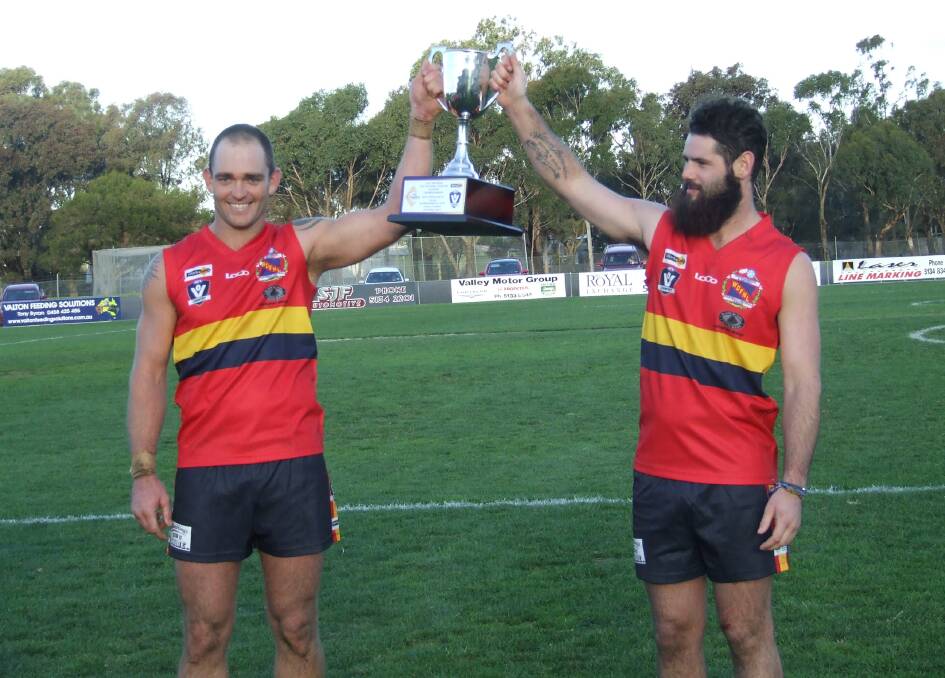 Warrnambool and District League coach Darcy Lewis and captain Leatham Robe with the cup. Picture: LAURIE WILLIAMS 