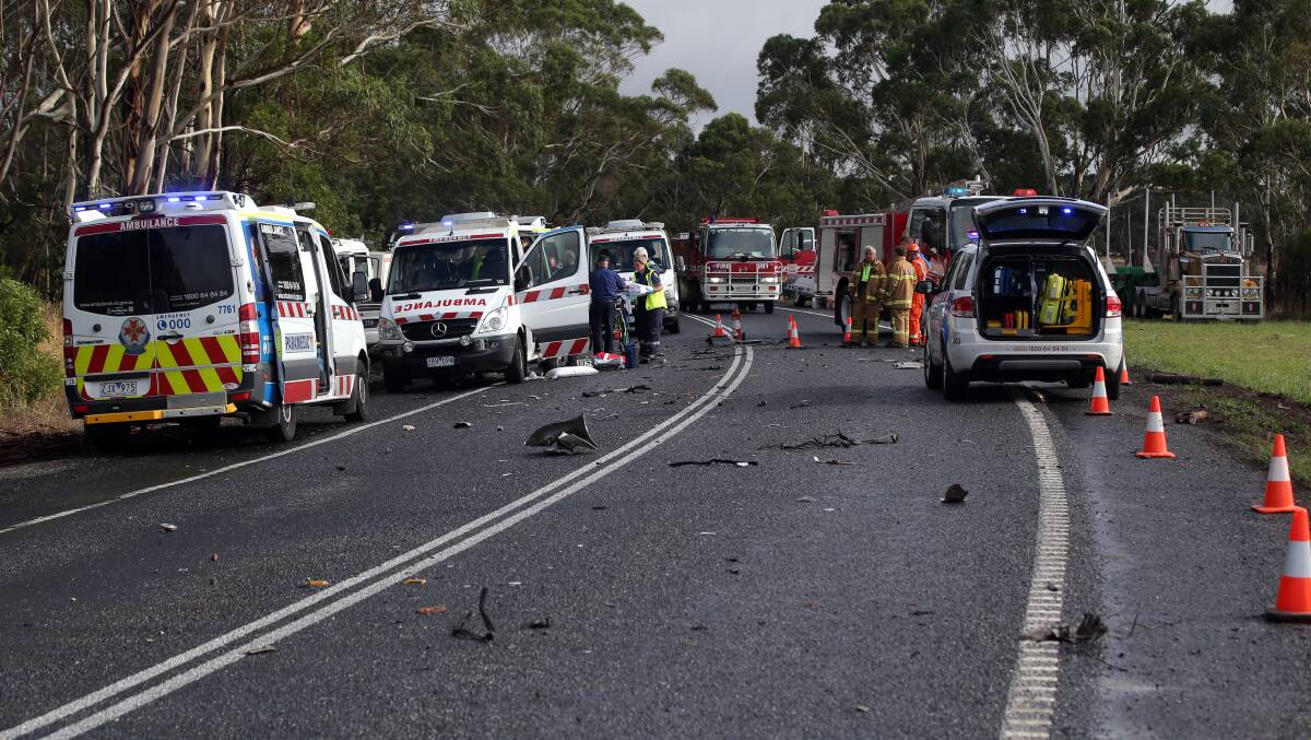 Emergency services work at the scene of yesterday's smash at Elingamite, which claimed the life of a 31-year-old Cobden man. Picture: DAMIAN WHITE 