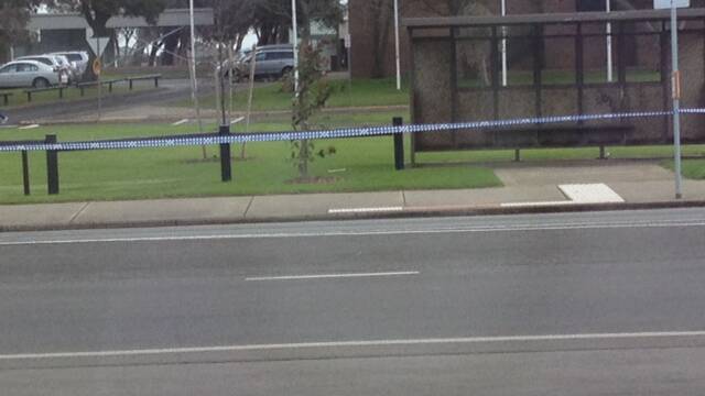 The device can be seen on the ground at the bottom of a tree, near the bus shelter. Picture: SUPPLIED 