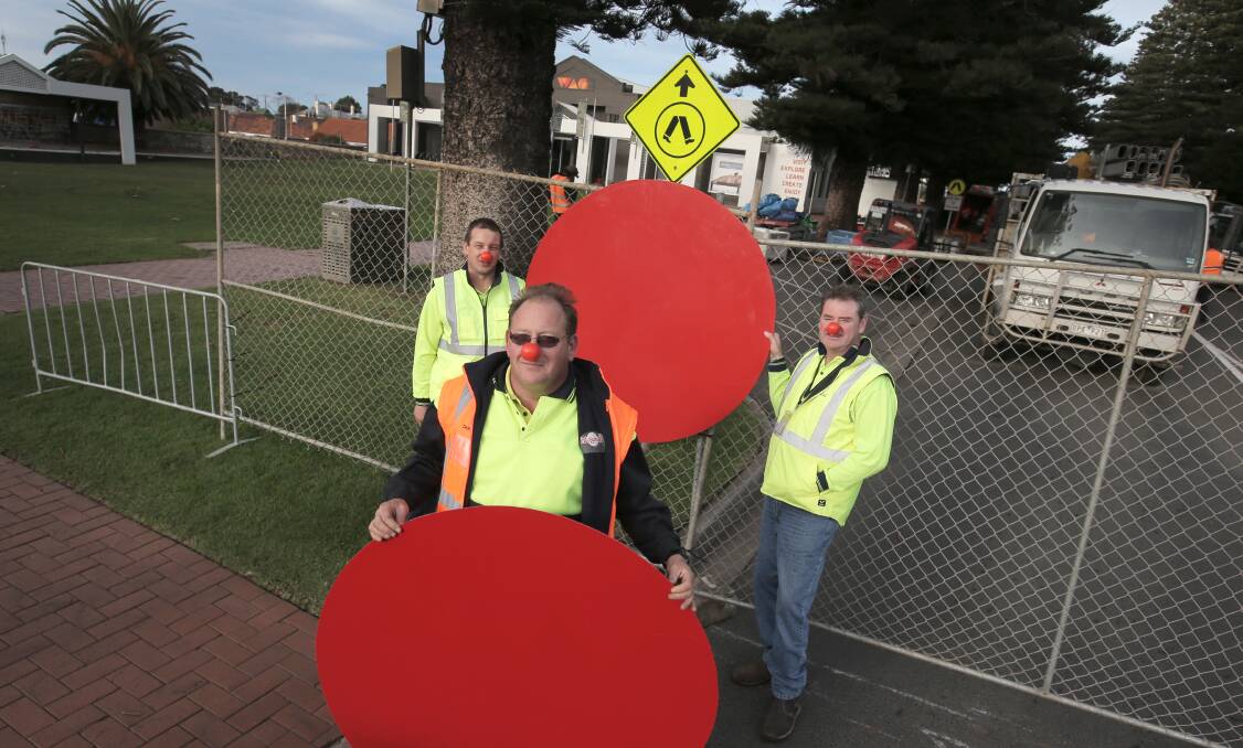 Fun4Kids site workers Craig Wiffrie, Darrell Hose (front) and site logistics manager Glenn Scott don Red Noses as the festival starts fundraising for the SIDS and Kids. 140611RG06 Picture: ROB GUNSTONE