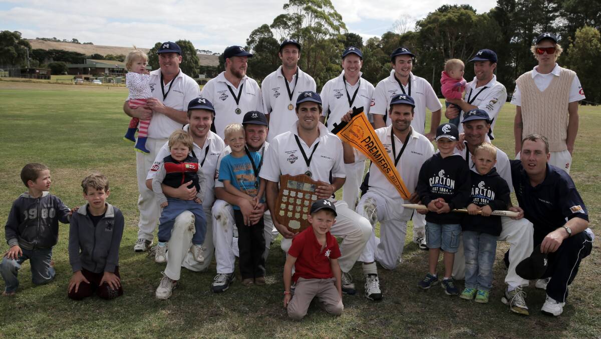 Mortlake A Grade team, and their supporters, celebrate their third Grand Final win yesterday. 