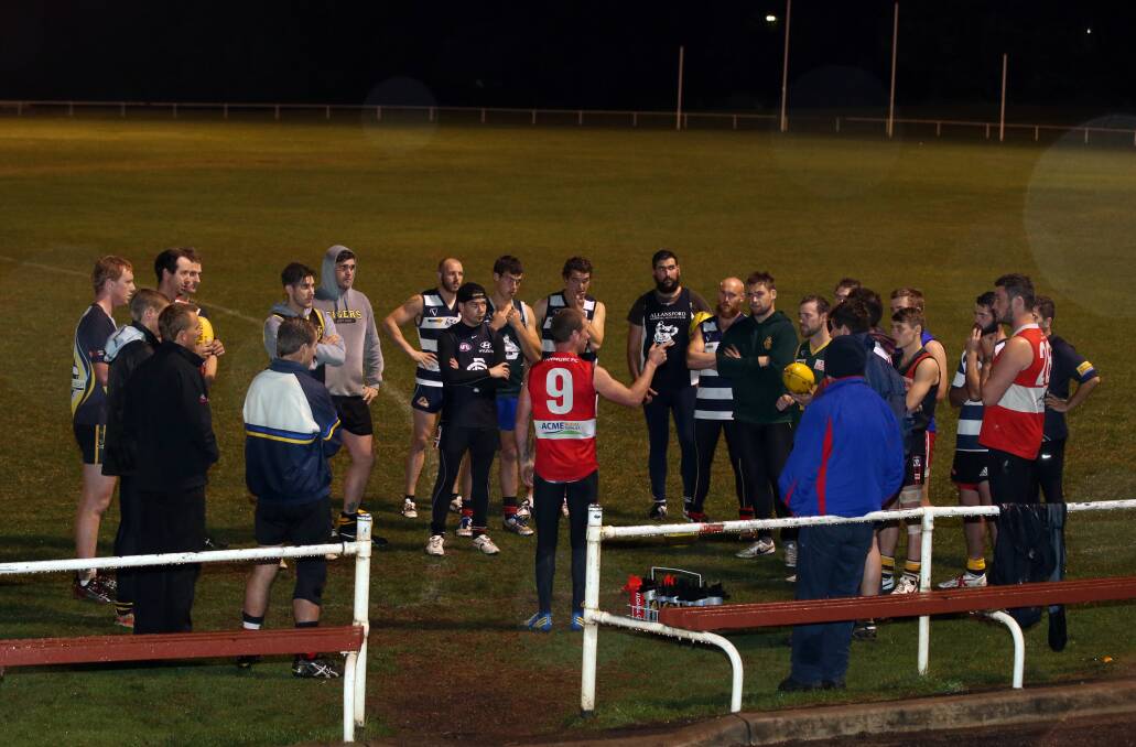 Coach Simon O’Keefe addresses the Warrnambool and District interleague squad last night. The WDFNL clashes with Colac and District tomorrow. 