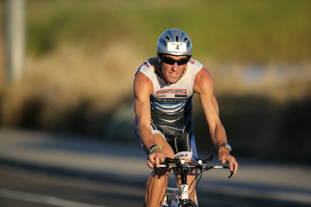 Kris McCartney gets on his bike during the 2013 Sufferfest triathlon in Warrnambool.   130303DW32 Picture: DAMIAN WHITE
