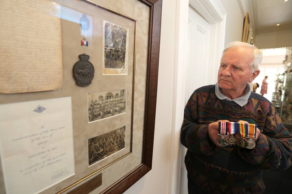 Don Stevenson, of Warrnambool, with the WWI service medals of his grandfather Harry Stevenson — among the last Australian soldiers to be evacuated from Gallipoli 99 years ago — and a display board of memorabilia of his service.141216RG24 Picture: ROB GUNSTONE