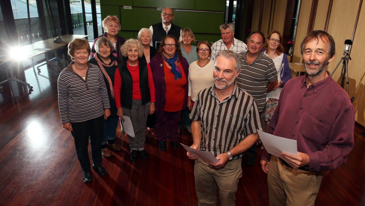 Geoff Barker (front left) and Philip Shaw, co-leaders of the ‘One World Many Voices’ choir, with members of the choral group during rehearsals at Warrnambool’s Christ Church Hammond room last night. 