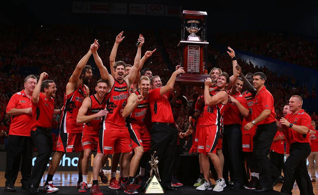 Trevor Gleeson (centre, holding trophy) with his victorious Perth Wildcats players. Picture: GETTY IMAGES