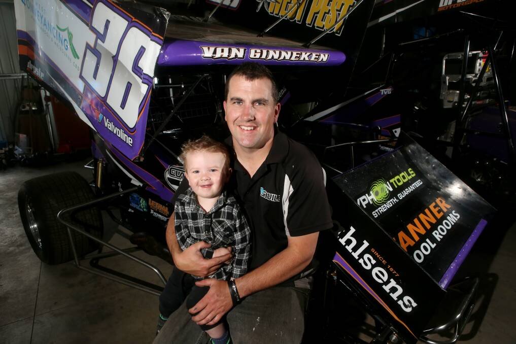 Tim van Ginneken and son Chase, 19 months, check out some new racing wheels. 141029AS10 Picture: AARON SAWALL