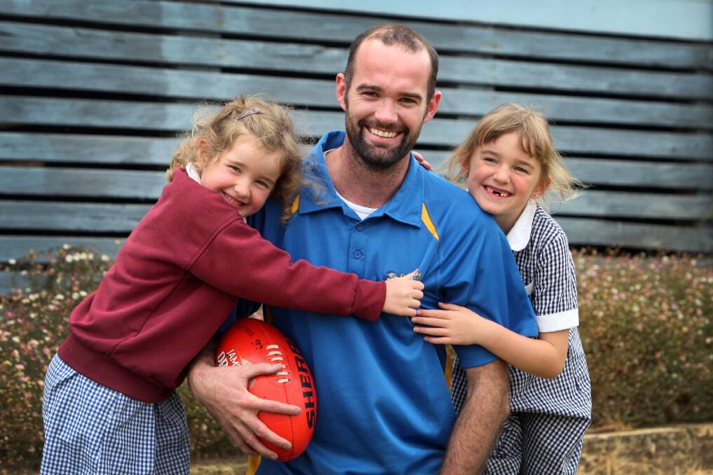 Deakin University coach Matt Lenehan, with daughters Olivia, 6, (right) and Paige, 5, believes long-term recruiting and a happy atmosphere around the club are vital to the Sharks’ future. 140327LP11 Picture: LEANNE PICKETT