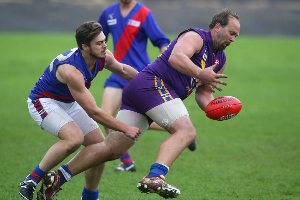 Terang Mortlake’s Jake Richardson (left) pressure Port Fairy key forward Gary Robinson in last year’s pre-season cup. Terang Mortlake won’t be involved this year due to another practice match commitment.140315DW13 Picture: DAMIAN WHITE